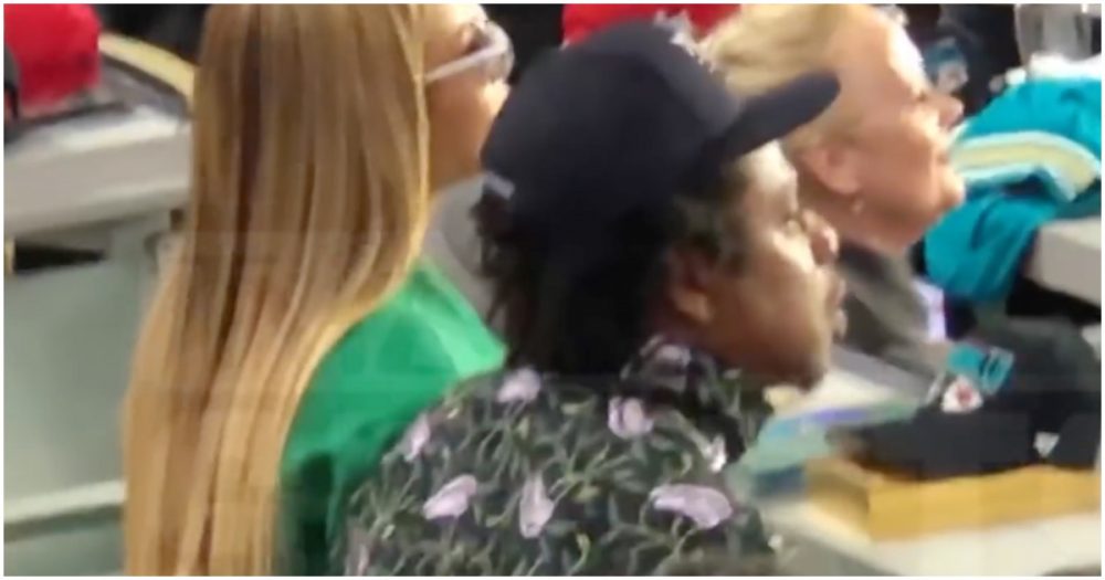 Beyonce and Jay-Z seated during the National anthem; people react