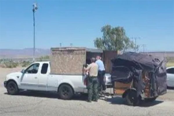 Police find children inside makeshift box behind truck