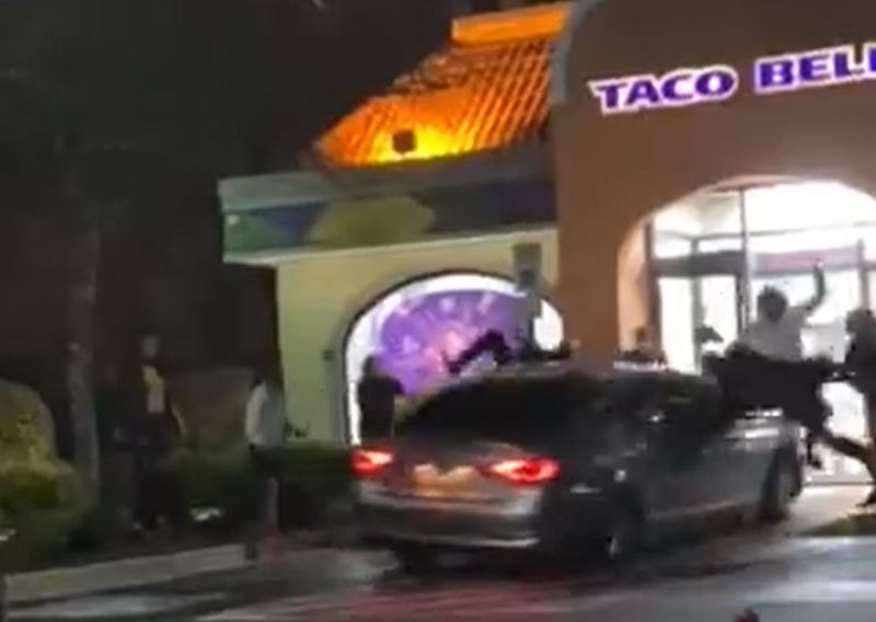 Two women charged after driving through crowd, Taco Bell