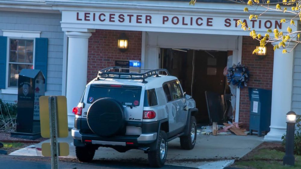 Man is shot and killed after driving SUV into police lobby