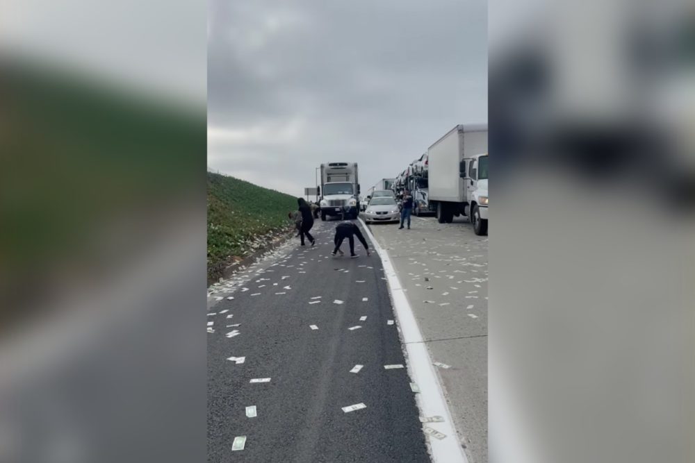 Armored Truck Spills Money On Highway; 2 arrested